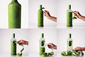 Peeling a green wrapper off a Smirnoff Caipiroska bottle 