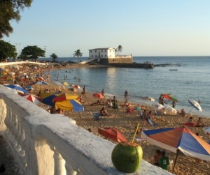 Salvador beach with many people and colorful umbrellas