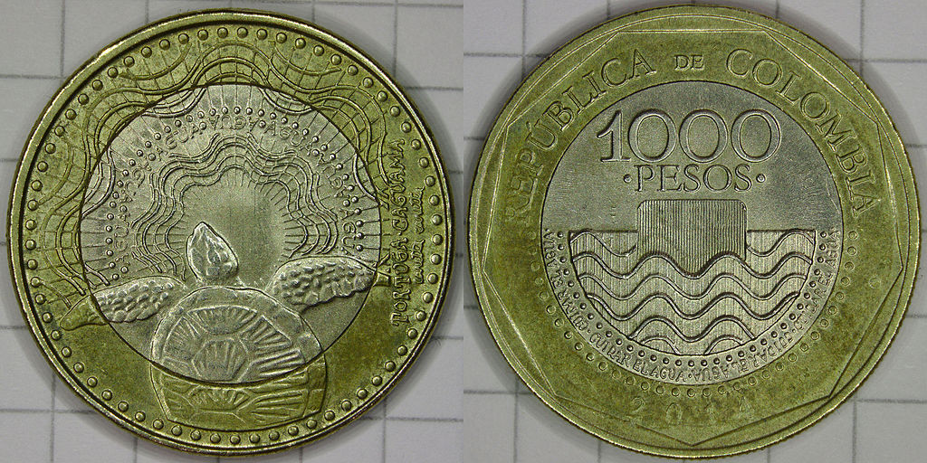1,000 Colombian pesos. Photo © Slashme (Own work) [<a href="http://creativecommons.org/licenses/by-sa/4.0">CC BY-SA 4.0</a>], <a href="https://commons.wikimedia.org/wiki/File%3AColombian_1000_Peso_Coin.jpg">via Wikimedia Commons</a>.