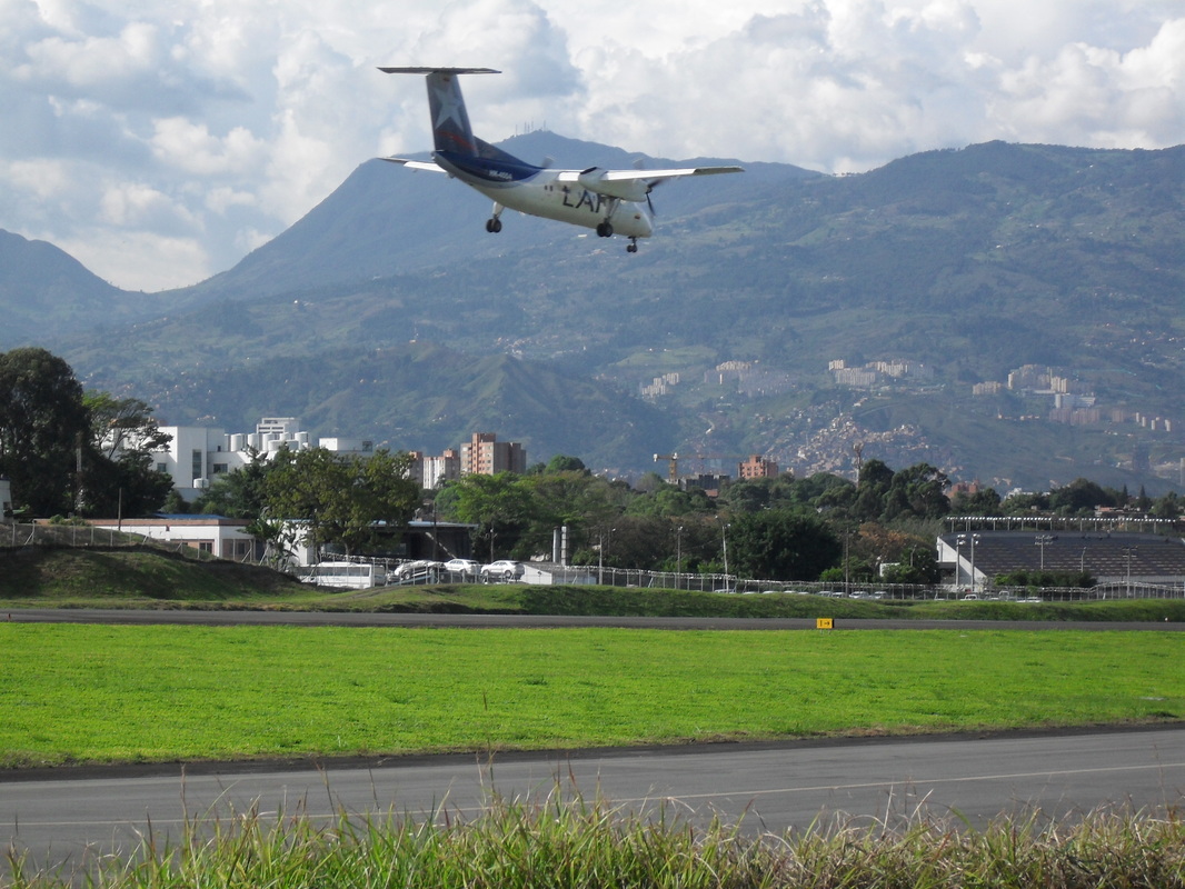 A plane lands at Olaya Herrera Airport in Medellín.