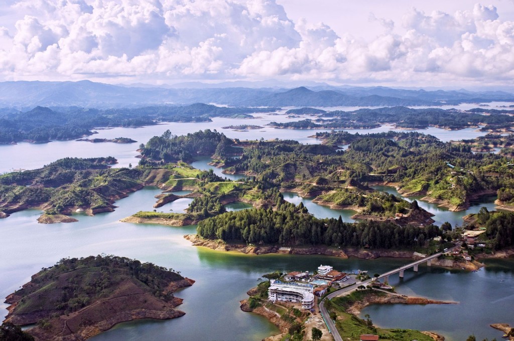 A reservoir stretches out around small islands covered in trees.