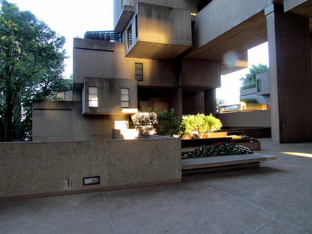 A housing complex constructed of concrete that resembles blocks stacked and overhanging one another.