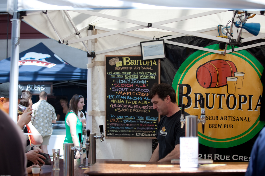A colorful chalk board advertises the brews on tap in a vendor stall.
