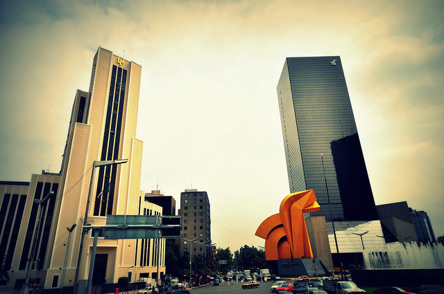 The art deco La Loteria building on the left and the Torre del Cabillito on the right along Mexico City's Paseo de la Reforma.