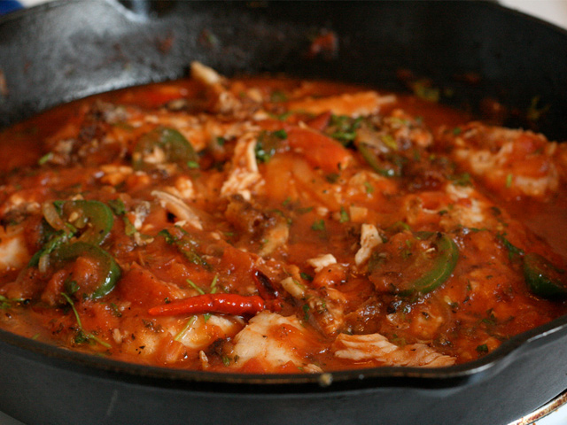 Red snapper, Veracruz style, baked or fried in a tomato-based sauce with olives, capers, onions, garlic, and chile pepper, along with a mix of spices.