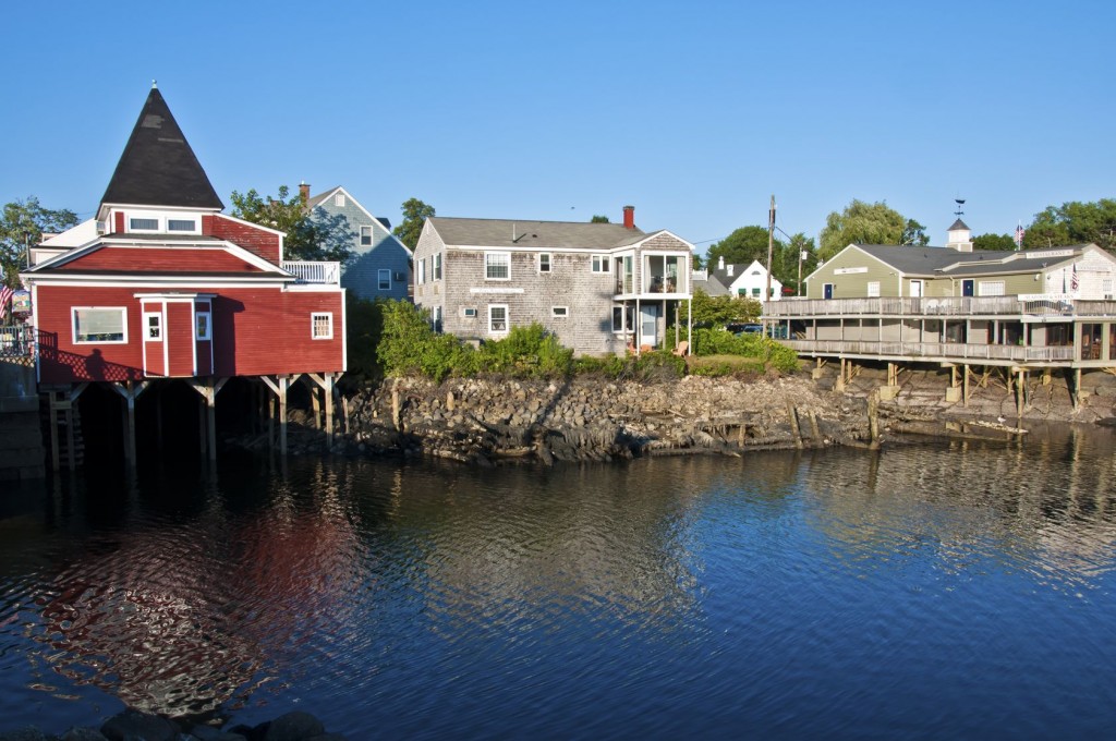 At the water's edge, charming houses are built on pilings.