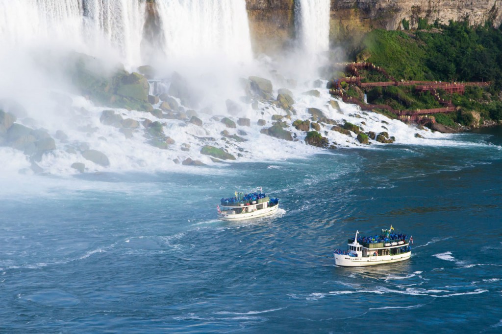 Two boats approach Niagara Falls as part of the Maid of the Mist boat tour.
