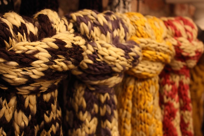 A row of thick knit scarves for sale at Verde in Philadelphia.