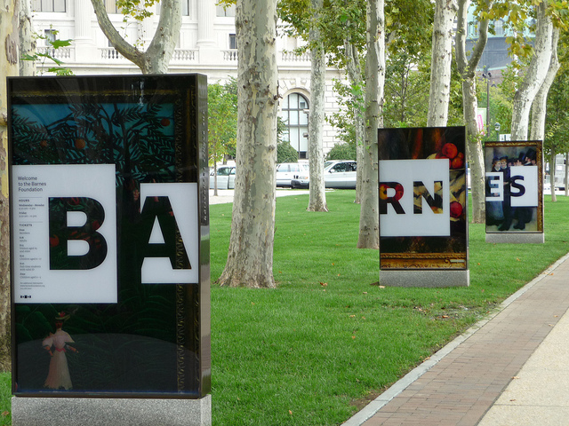 The letters BA-RN-ES on staggered signs featuring images from the collection.