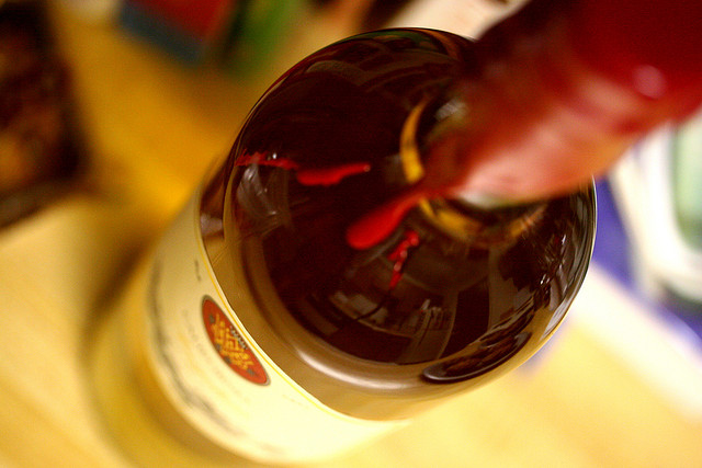 Close-up view of the neck of a wine bottle.