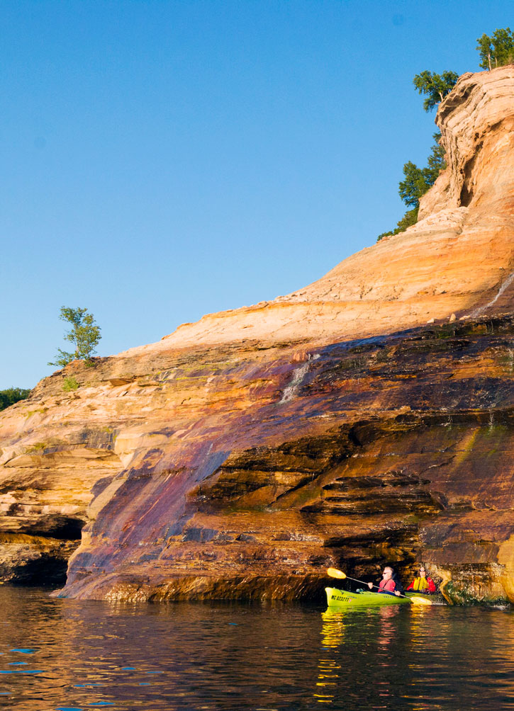 Kayaking past Bridalveil Falls in Pictured Rocks National Lakeshore. 