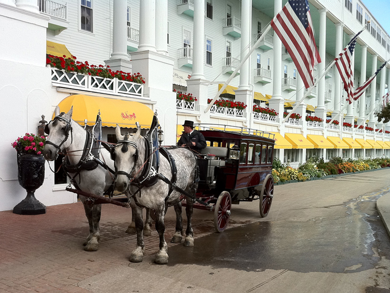 Horse and buggy wait outside the Grand Hotel.