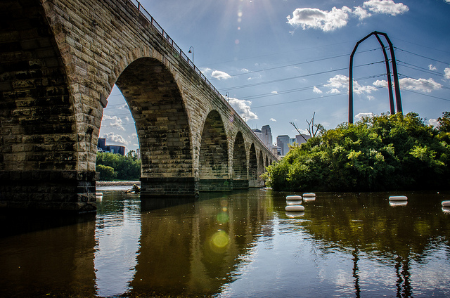 View of the stone arch bridge spanning the Mississippi River in Minneapolis.