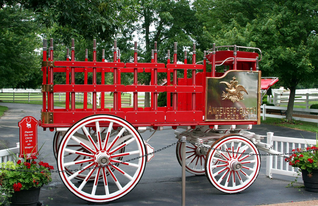 The traditional red-painted beer wagon famously pulled by Clydesdale horses.