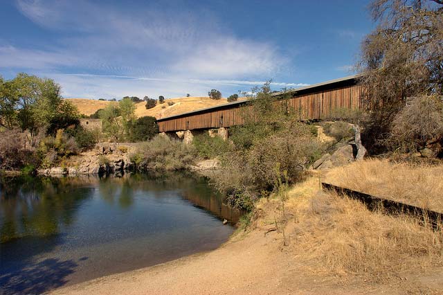 A long covered bridge over the Stanislaus River in California.