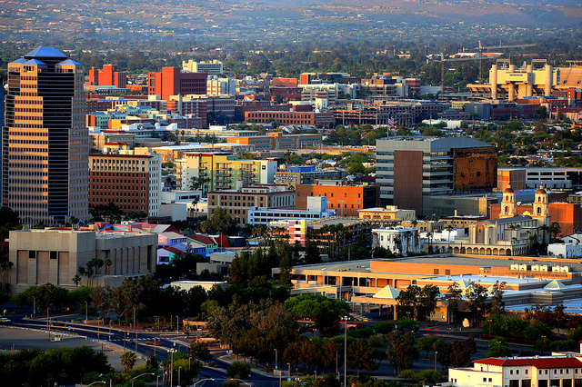 Angled late-afternoon sunlight hits the colorful buildings of Tucson's downtown.