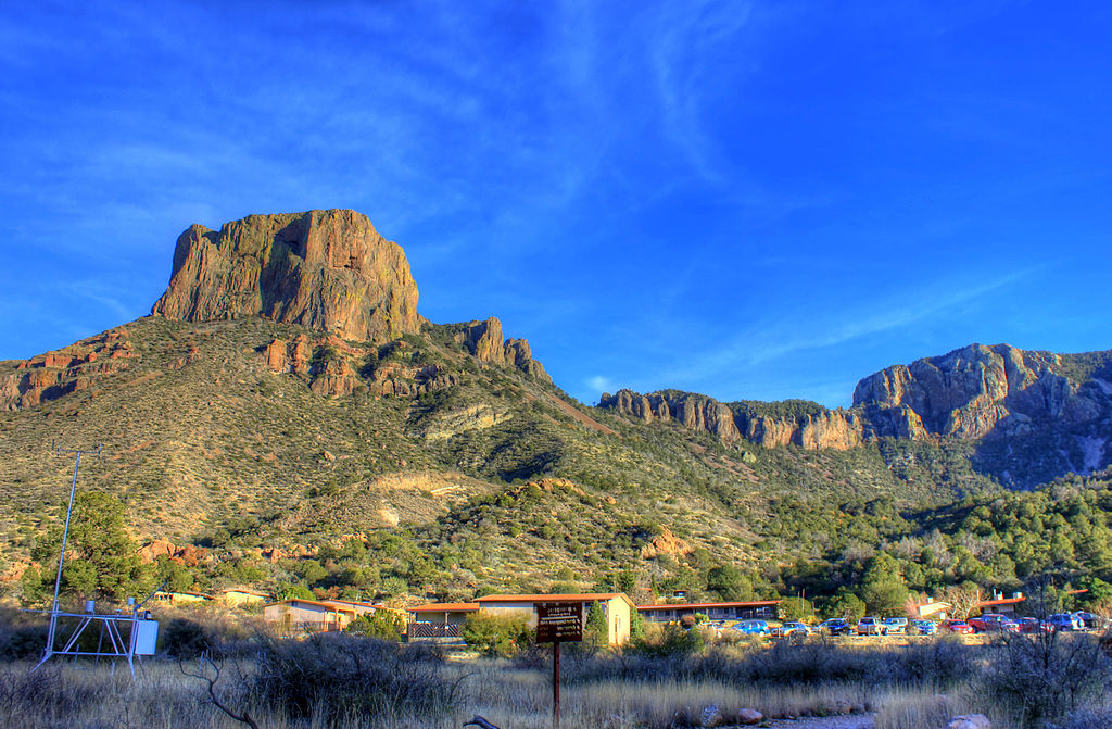 Casa Grande rising above the Chisos Lodge in Big Bend National Park. Photo © Yinan Chen [Public Domain], via Wikimedia Commons.