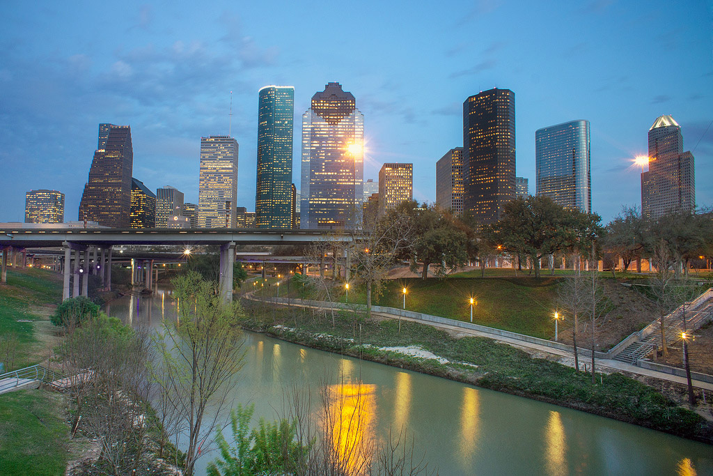 View of the Houston skyline with the Buffalo Bayou greenbelt in the foreground.