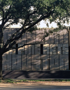 A wall with block text in relief reading Houston Museum of Fine Arts.