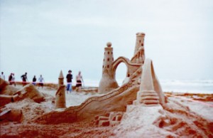 A delicately designed sandcastle on the beach.