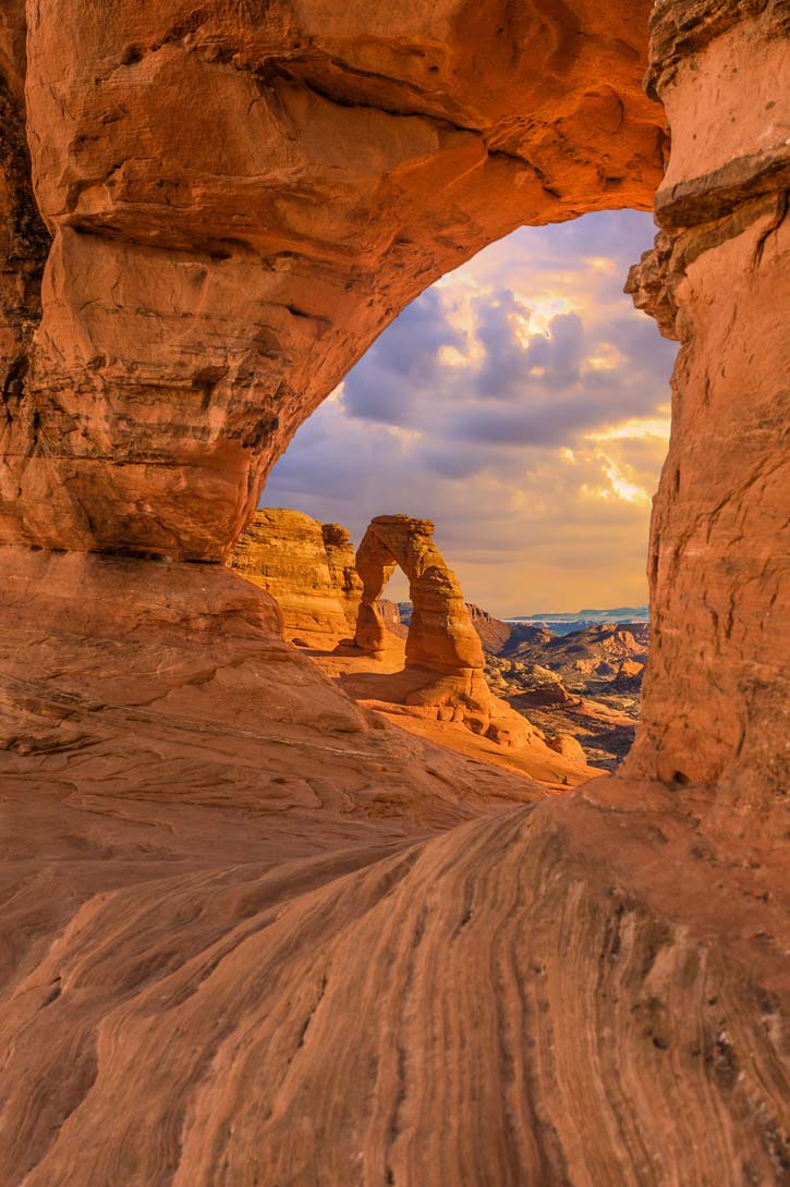 View through a sandstone arch at Arches National Park.