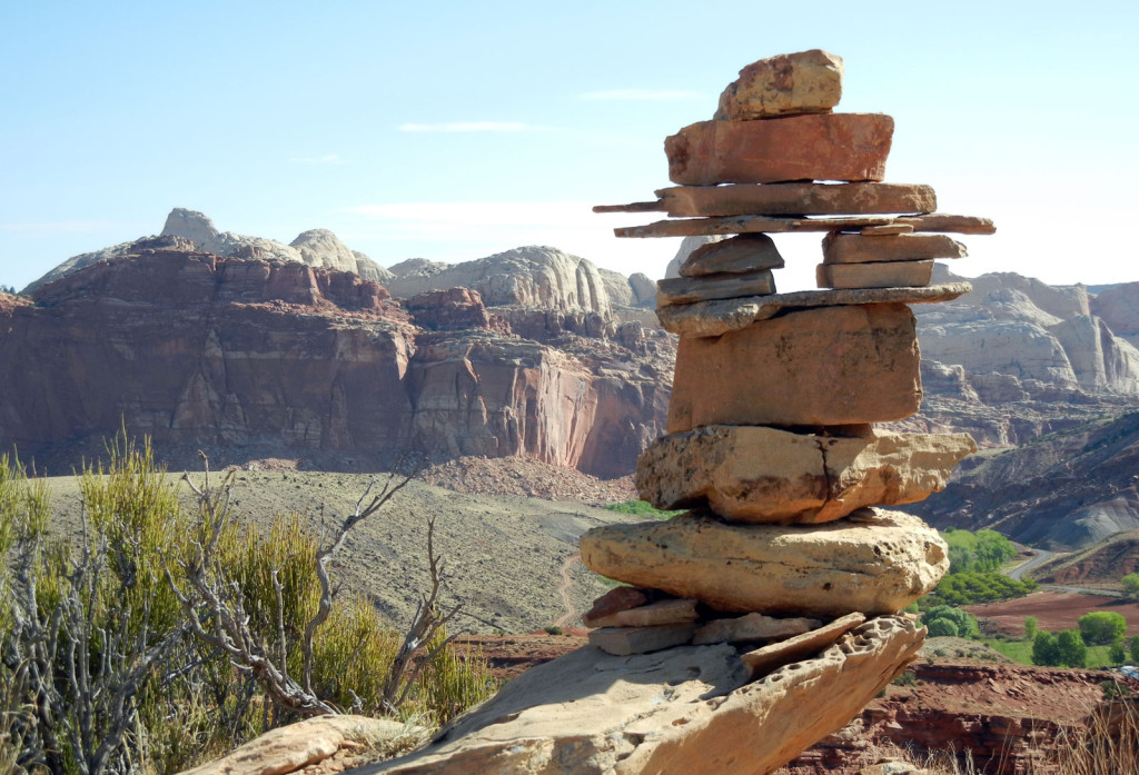 Flat and squarish stones piled to make a keyhole with a view of the canyons beyond.