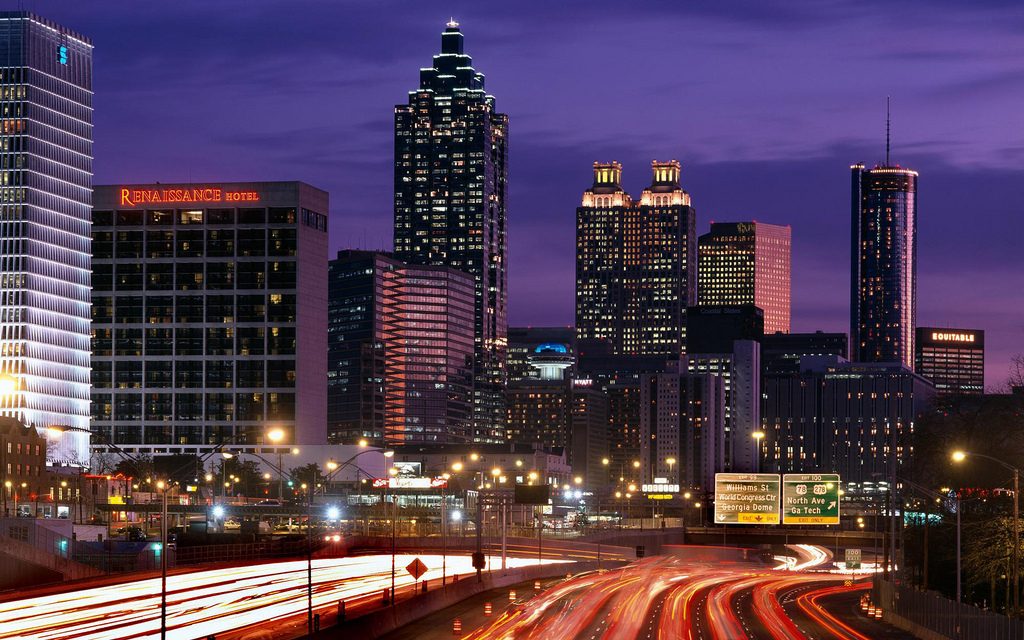 Downtown Atlanta skyline at dusk with the traffic lights blurring from the long exposure of the photo