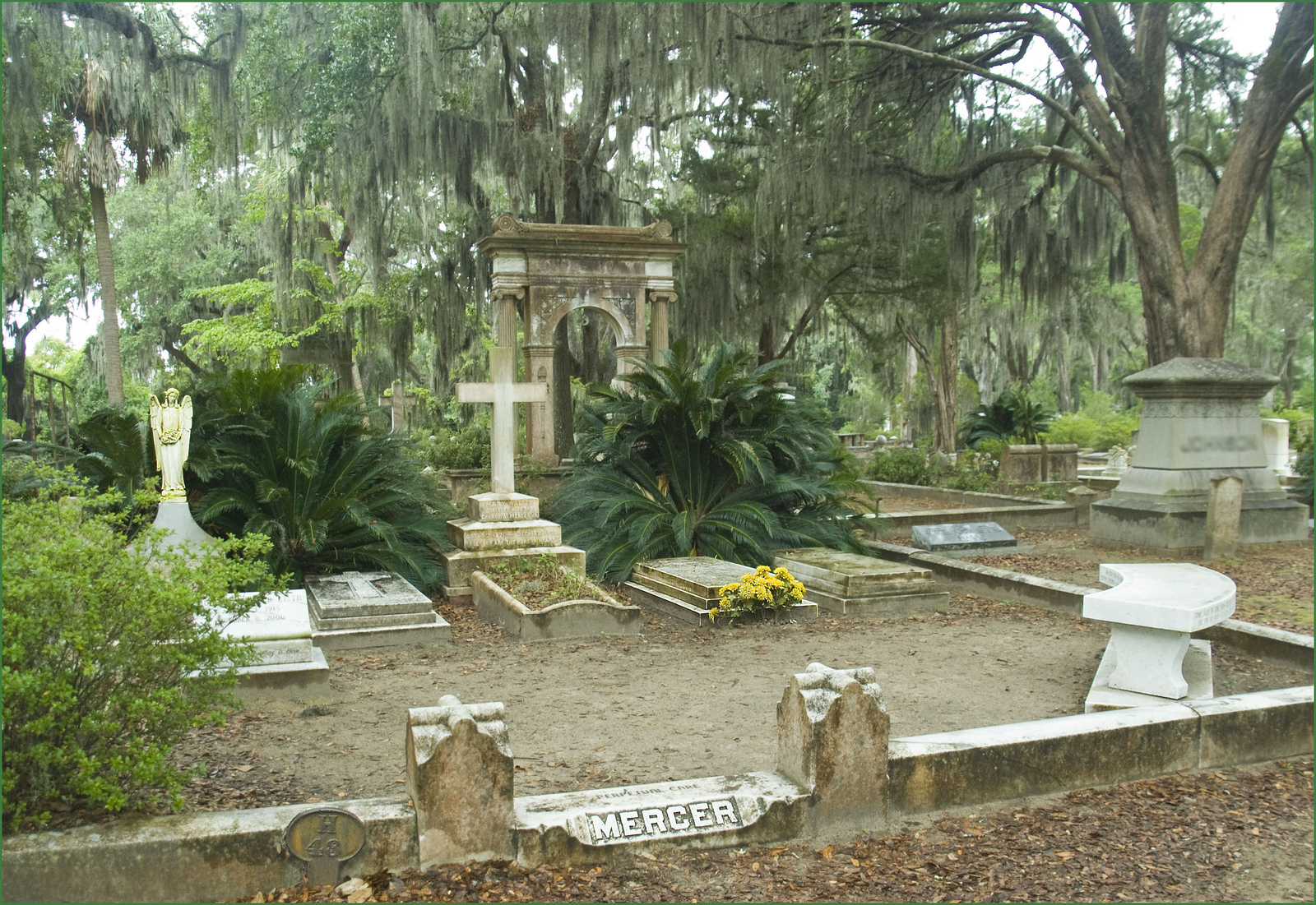 Mercer is carved in stone on a foot-high wall surrounding a plot of stone-covered graves.