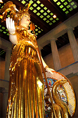A gilded statue of Athena stands watch inside the Parthenon.