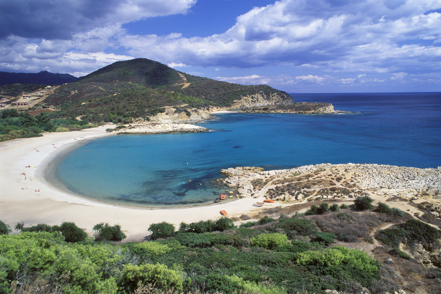 The soft sands and shallow waters of horseshoe-shaped Spiaggia Su Portu make it perfect for families