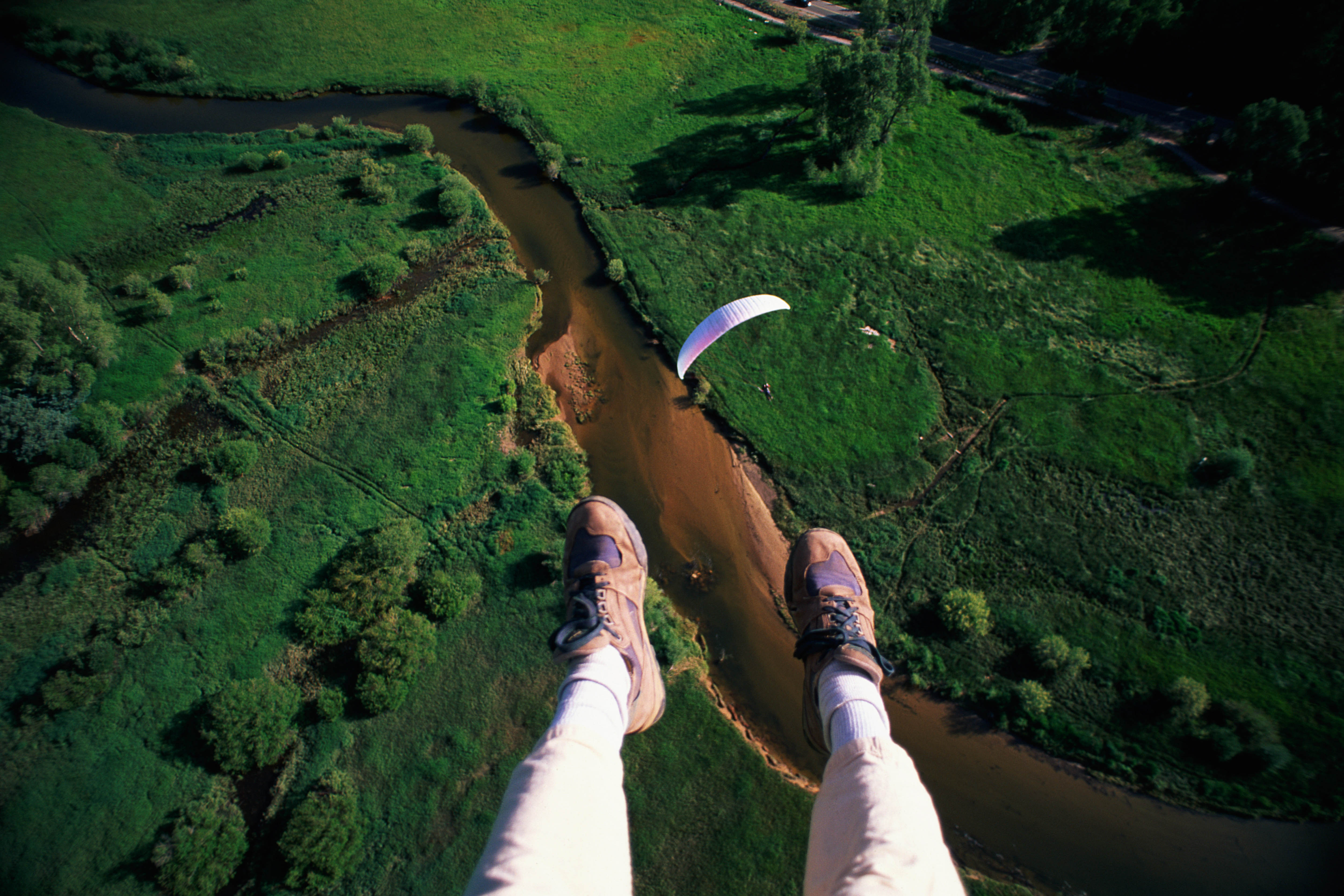 A paraglider’s-eye view above Colorado. Image by Tyler Stableford / Getty