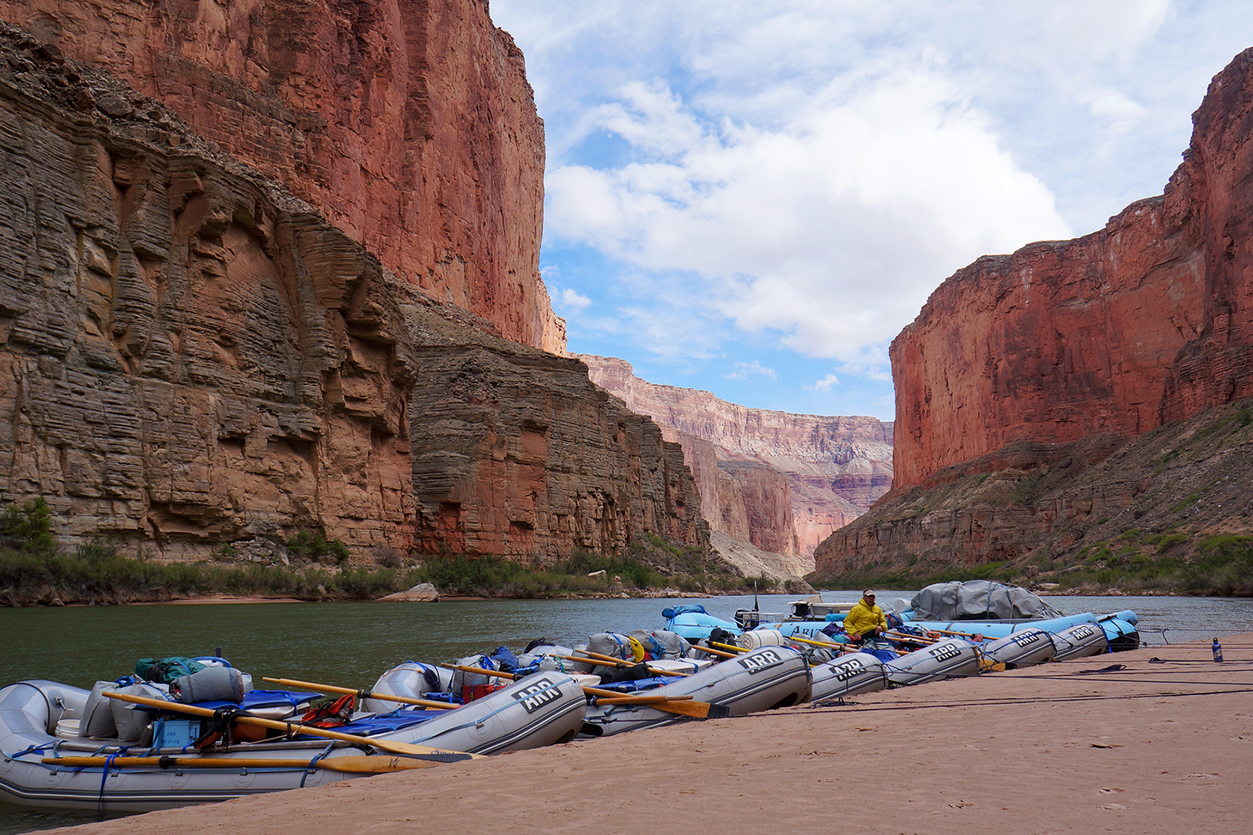 Rafts along the bank of the Colorado River in the Grand Canyon. Image by sean hobson / CC BY 2.0