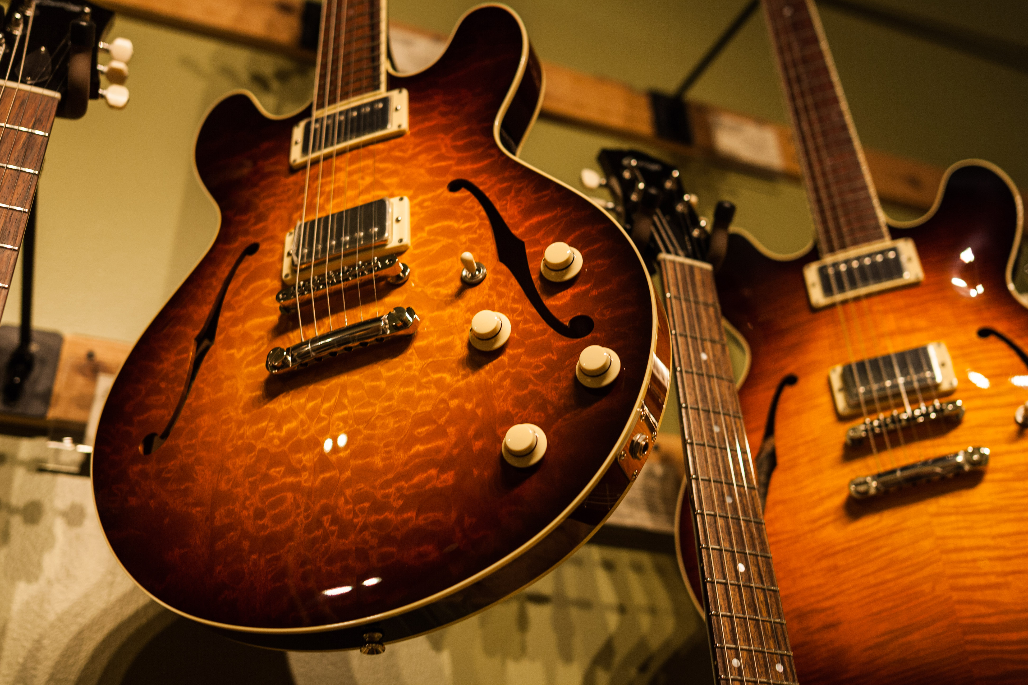 Classic guitars on a wall. Image by Alexander Howard / Lonely Planet