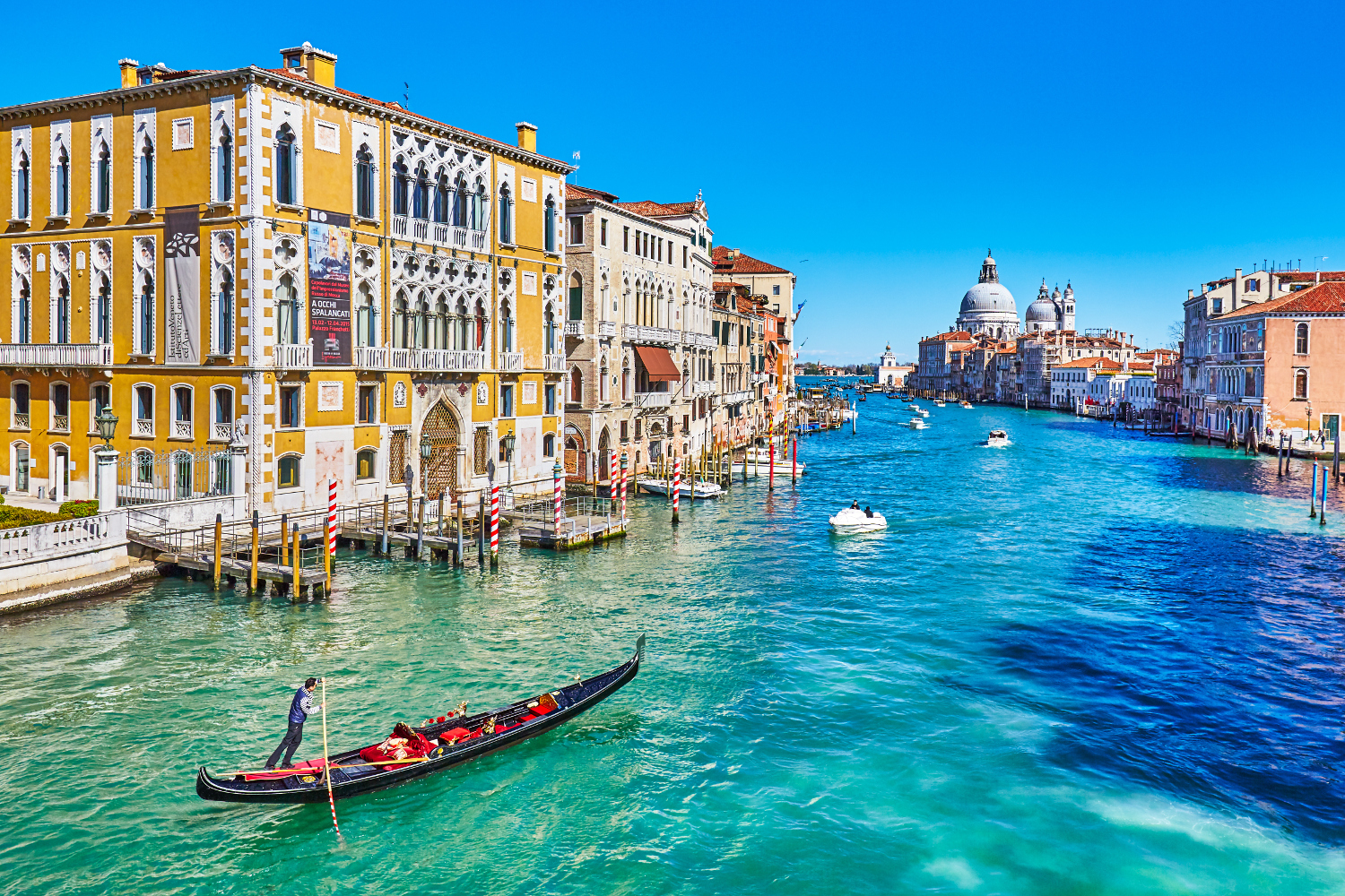 View along the Grand Canal, with Palazzo Franchetti on the left and Basilica di Santa Maria della Salute in the distance