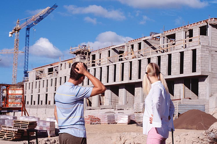 Arriving to find a building site where your hotel should be is an unfortunate way to start a trip. Image by Kelvin Murray / Stone / Getty Images.