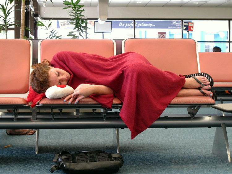 Pillow, blanket, sleep deprivation: the perfect recipe for an airport nap. Image by OakleyOriginals / CC BY 2.0.