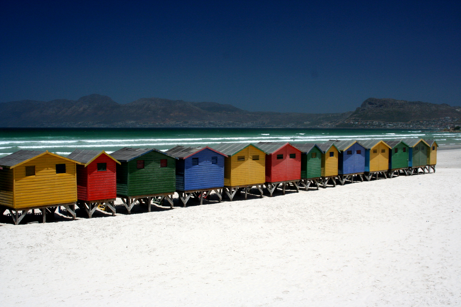 Beach huts at Muizenberg beach, Cape Town. Image by Simon Richmond / Lonely Planet
