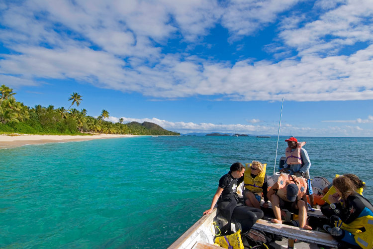 Preparing for a dive at Dravuni island near Kadavu. Image by Paul Harris / AWL Images / Getty Images
