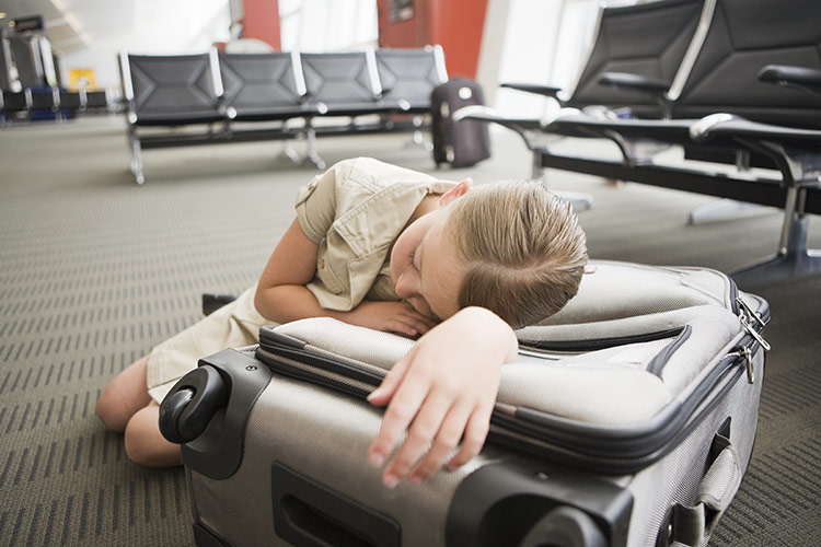 Suitcases with soft coverings might find a bonus use on long journeys. Image by Image Source / Digital Vision / Getty Images