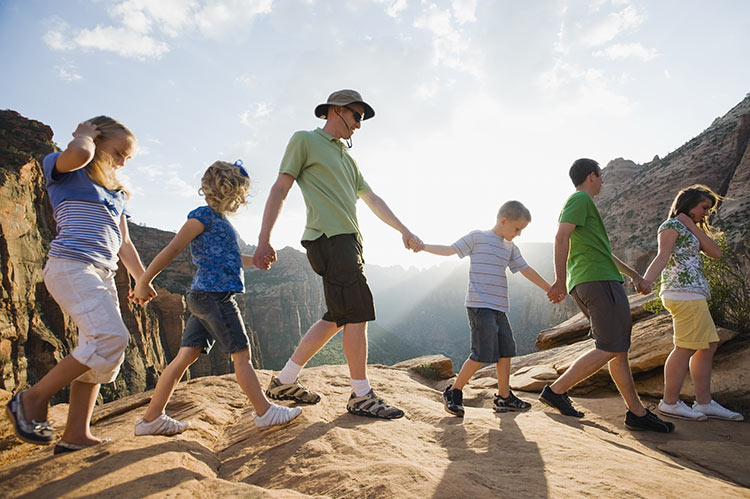 If all else fails, secure your family members by forming a human chain. Image by Tetra Images - Erik Isakson / Brand X Pictures / Getty Images