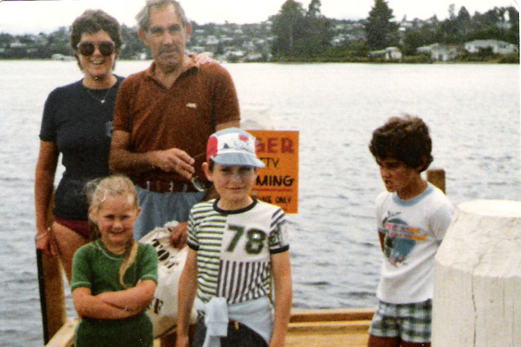 Freezing cold water - and a heartbreaking introduction to movies - hasn’t put Liz Heynes (bottom left) off Lake Taupo. Image by Liz Heynes / Lonely Planet.