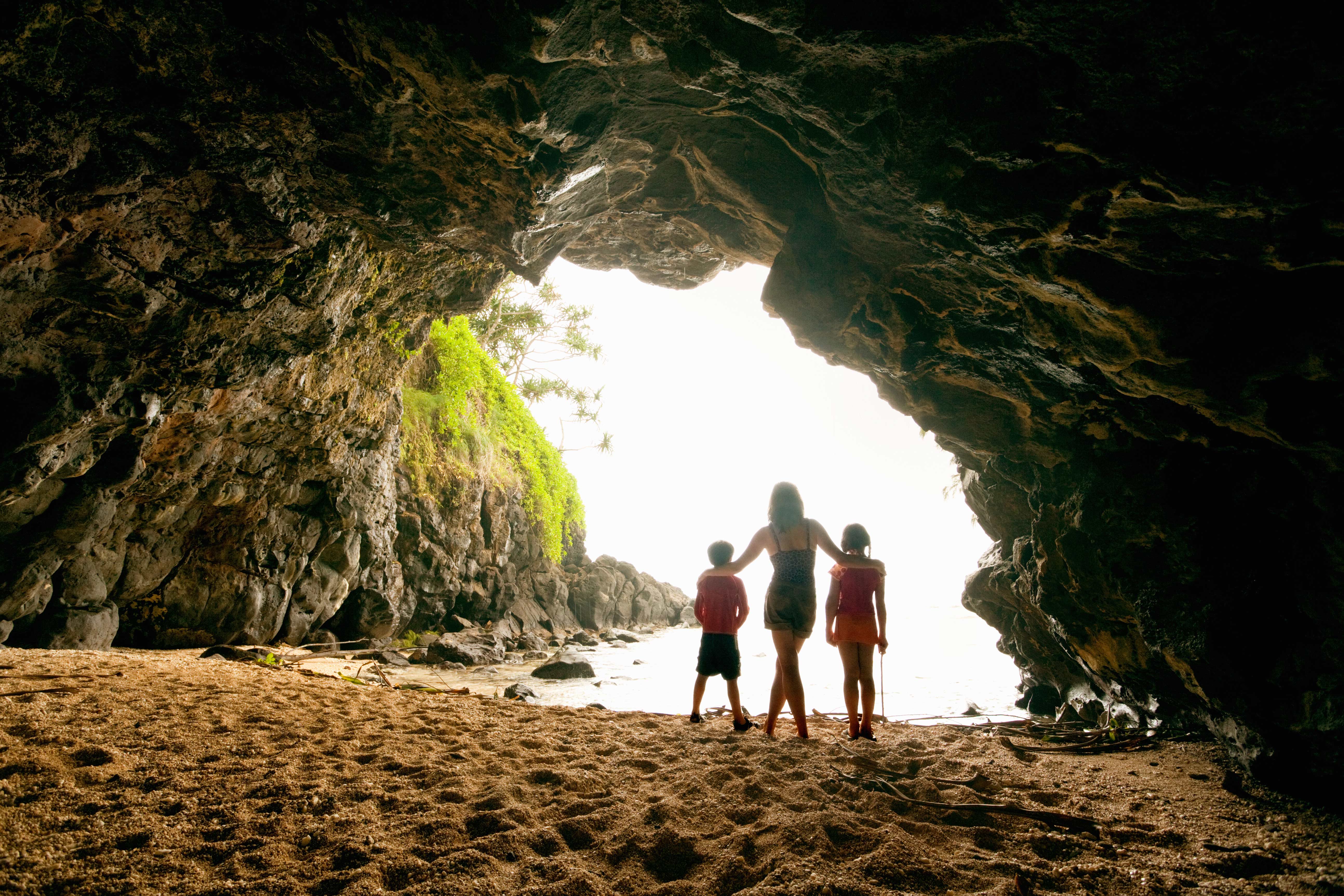 The Kauaʻi coast is the perfect place to explore geological features like this sea cave. Image by Keiji Iwai / Photographer's Choice / Getty