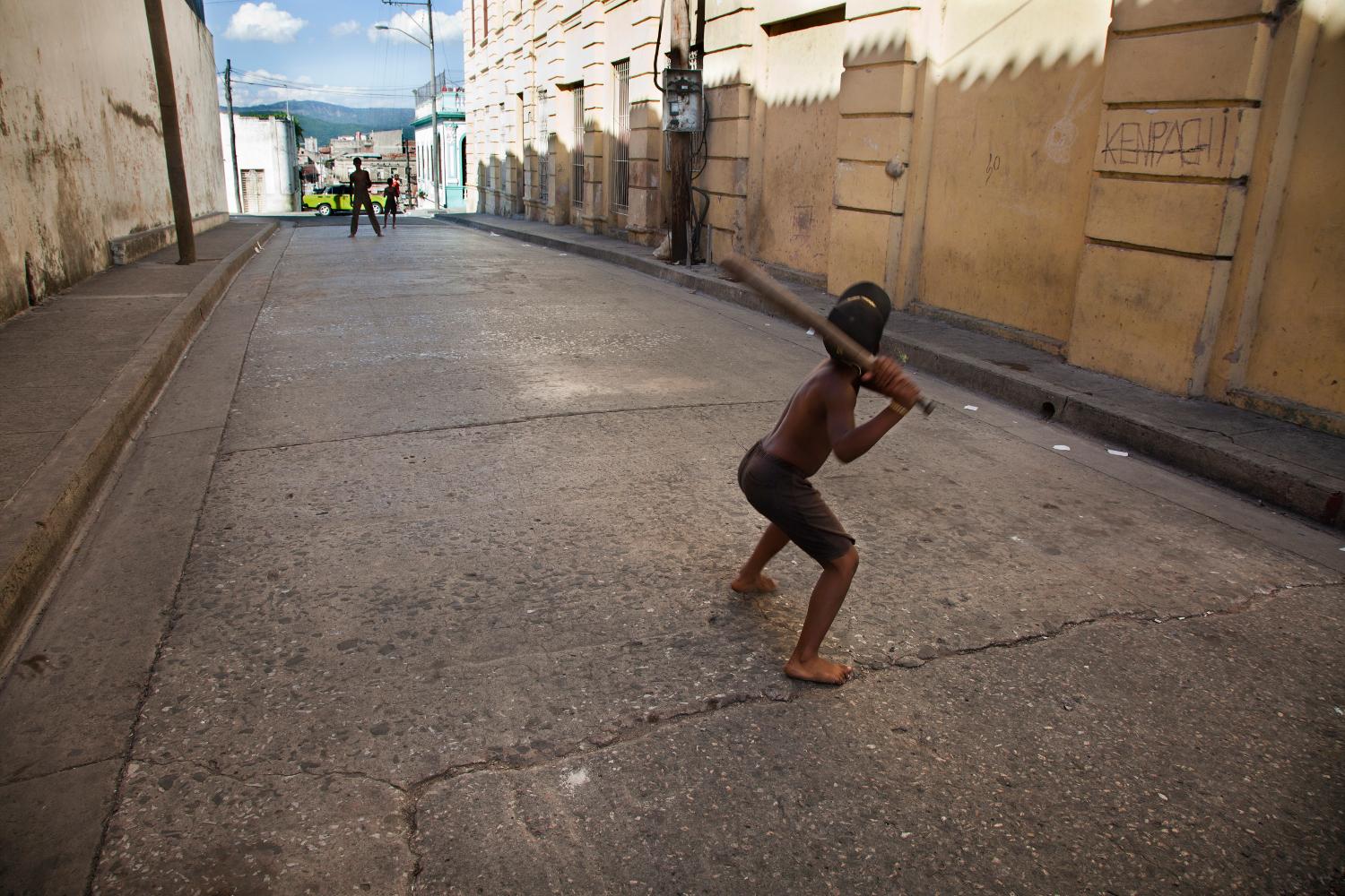 Local kids take over quiet backstreets for baseball practice. Image by Benjamin Rondel / First Light / Getty