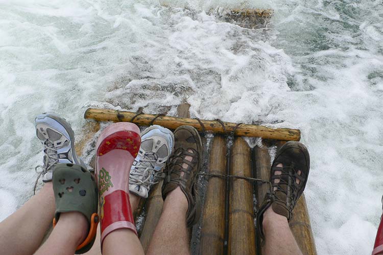 Bamboo rafting: fun for everyone. Image by Anna Willett / Lonely Planet