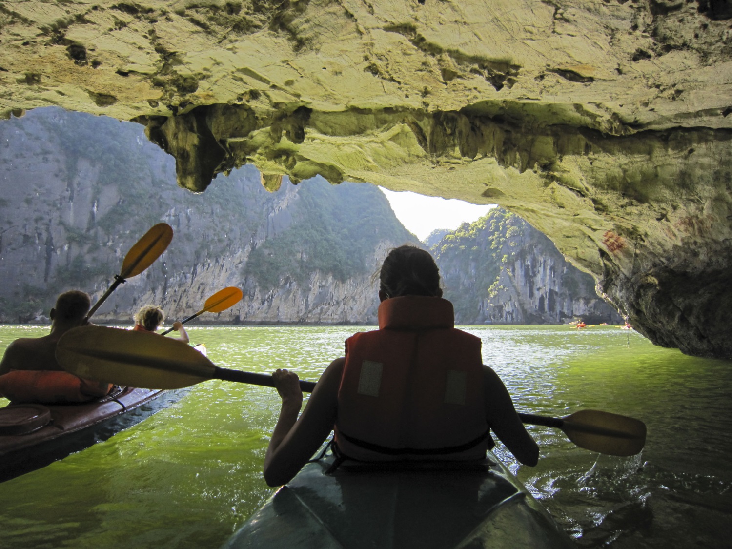 Kayaking through a cave, Halong Bay