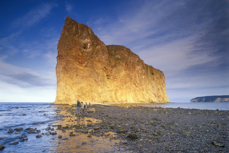 The impressive limestone Rocher Percé (Pierced Rock) stands sentinel at the tip of the Gaspé Peninsula. Image by Ron Erwin / All Canada Photos / Getty
