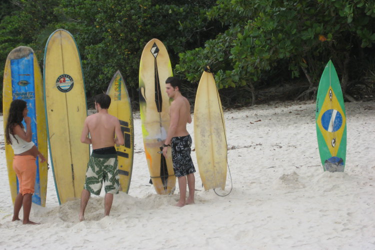 Surfers at the famous Praia Lopes Mendes. Image by Gregor Clark / Lonely Planet