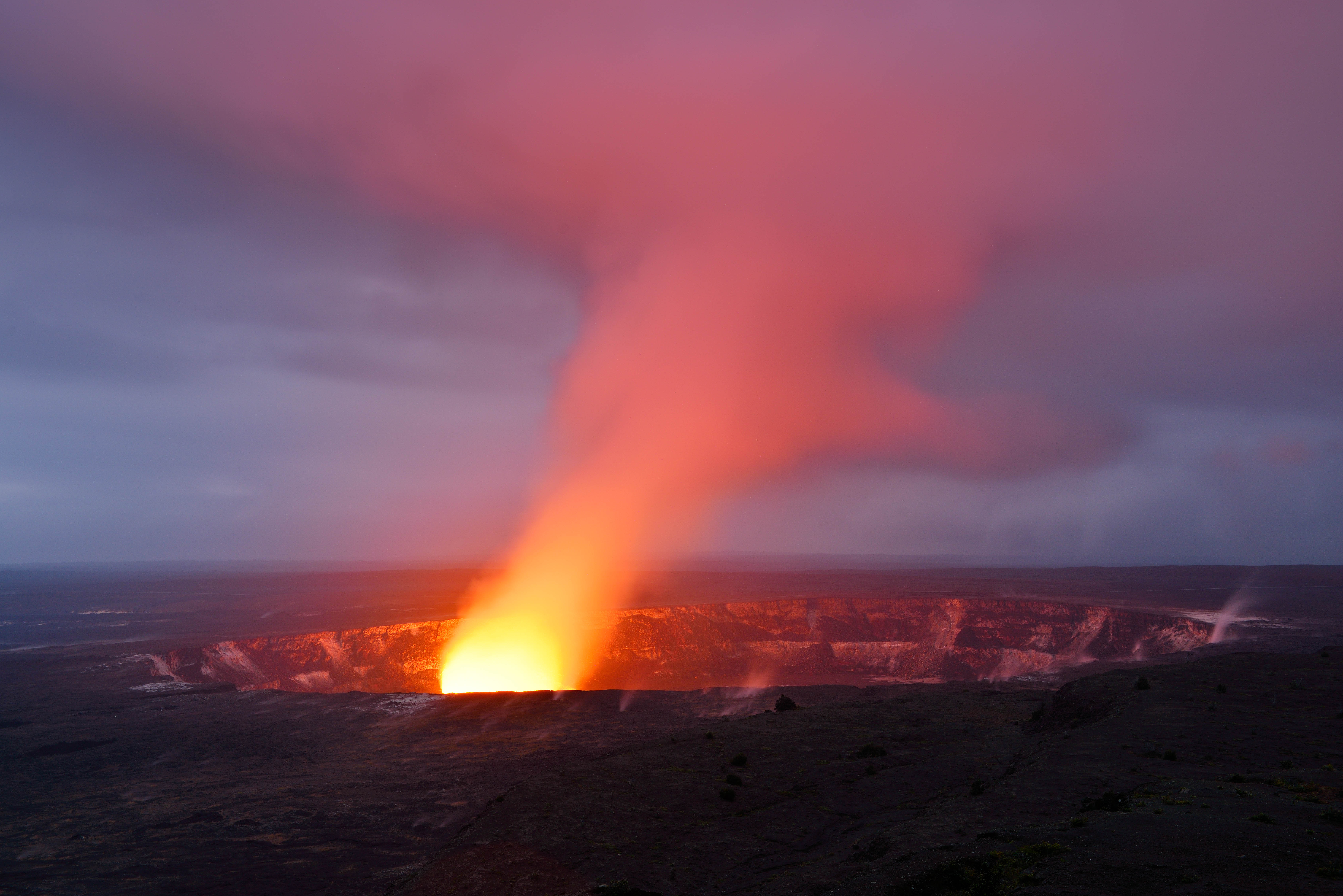 The Kilauea Caldera makes the perfect backdrop for grass-skirted hula dancers in Hawai‘i Volcanoes National Park. Image by Westend61 / Getty