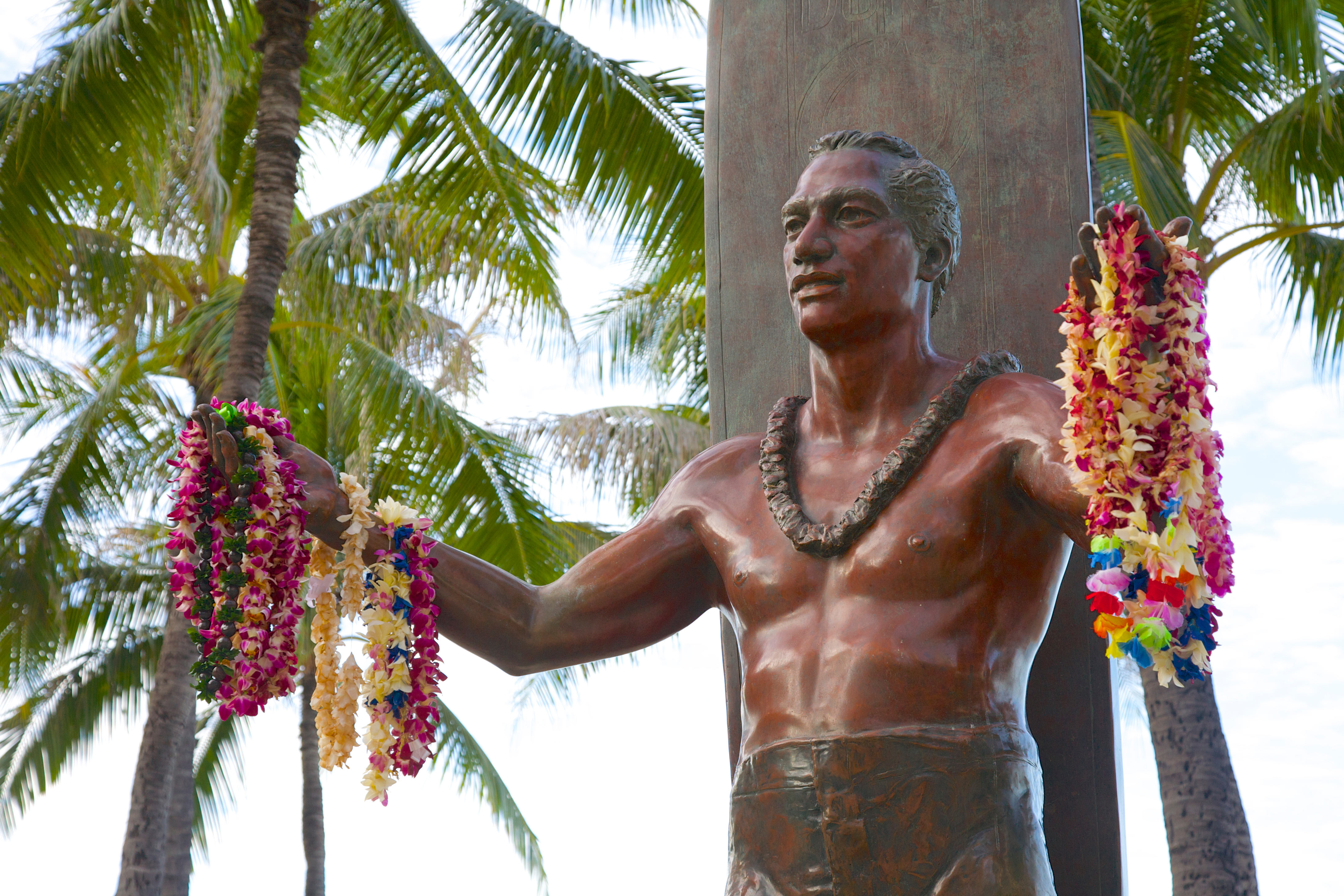 Statue of surf legend Duke Kahanamoku in Waikiki, O'ahu. Image by Barry Winiker / Getty