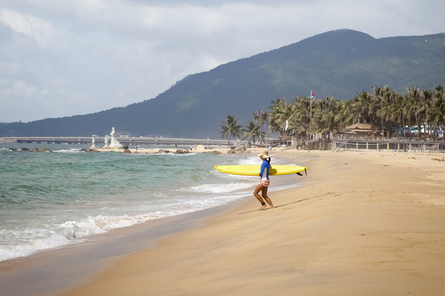 Hitting the waves at Sun and Moon Bay. Image by Dora Whitaker / Lonely Planet